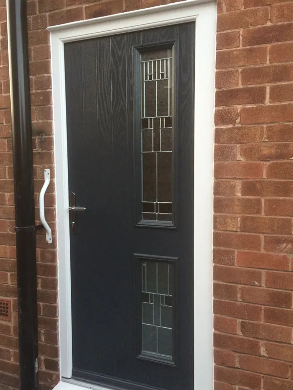 Black composite front door with decorative glass panels